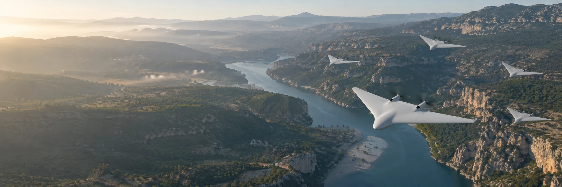 Formation of twin-propeller UAVs above a rugged river canyon