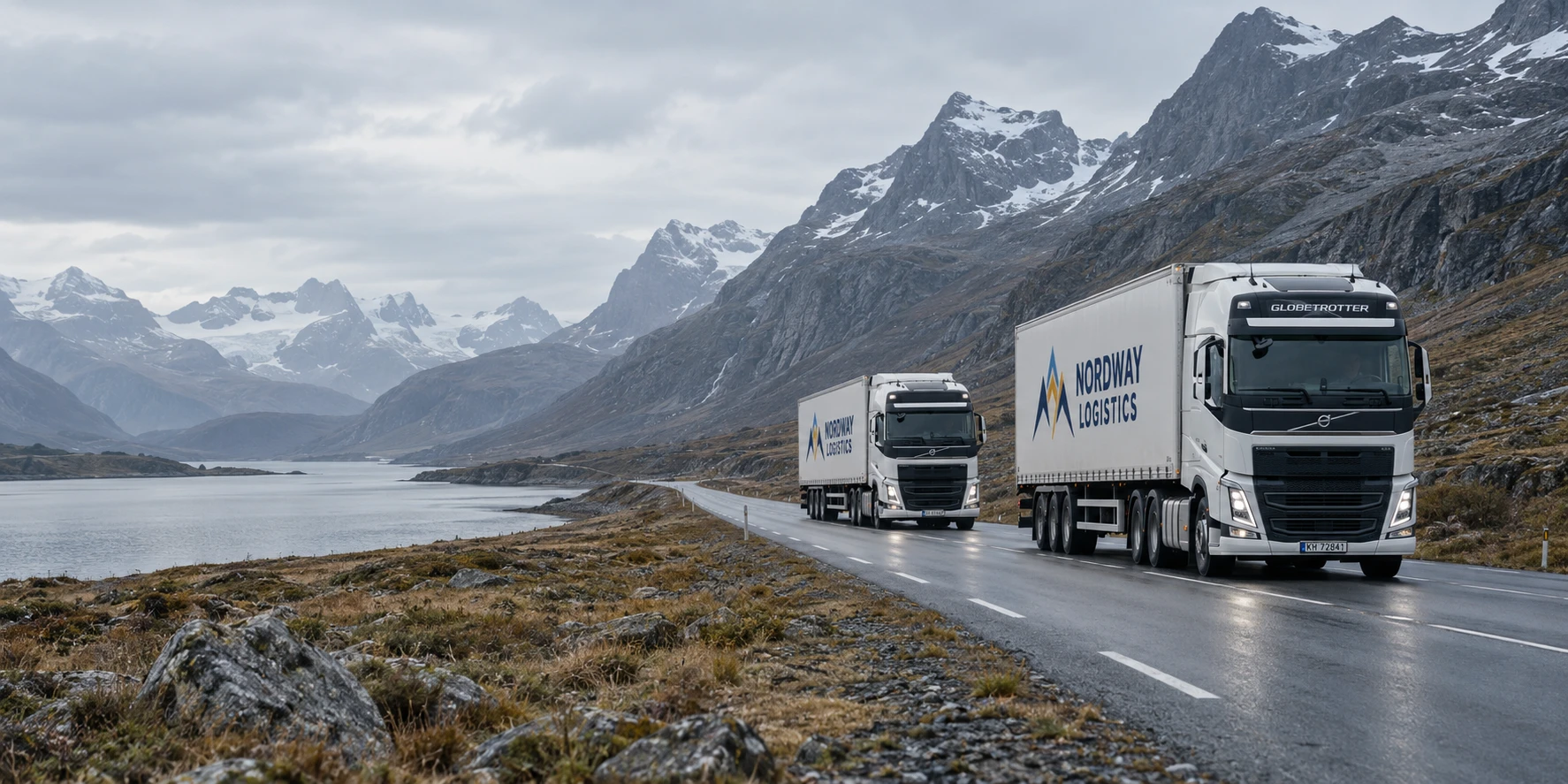Two logistics trucks crossing a remote mountain valley