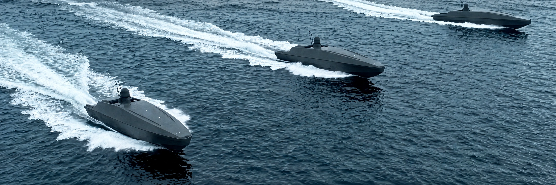 Three unmanned sea vessels operating at sea