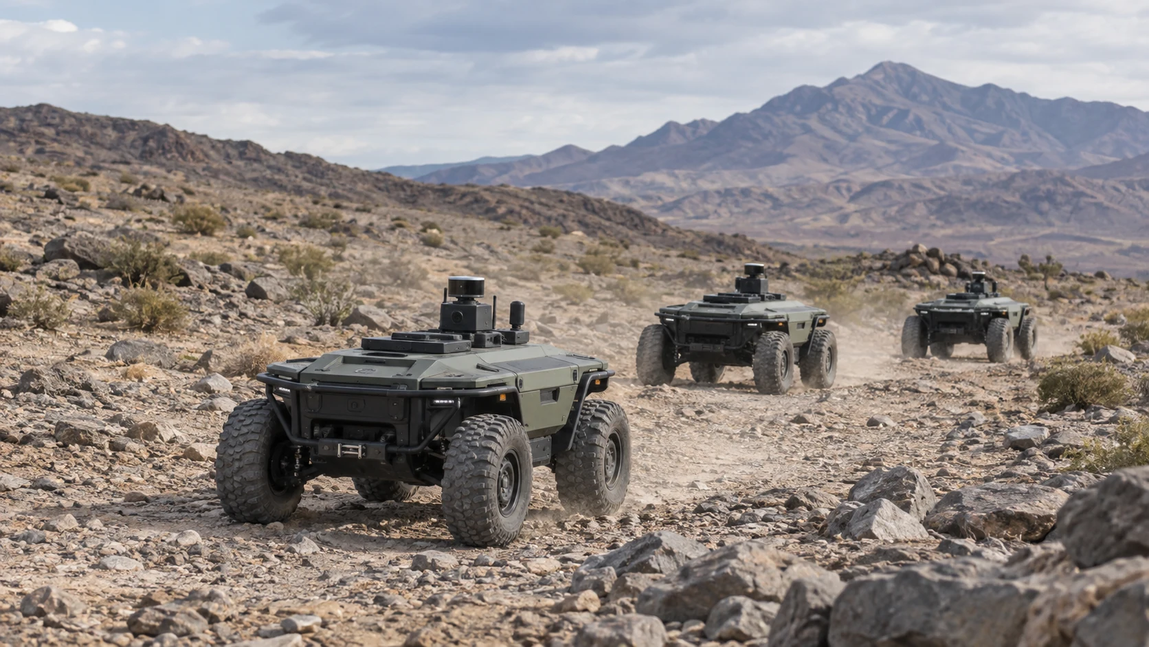 Conceptual illustration of unmanned ground vehicles moving across rugged desert terrain