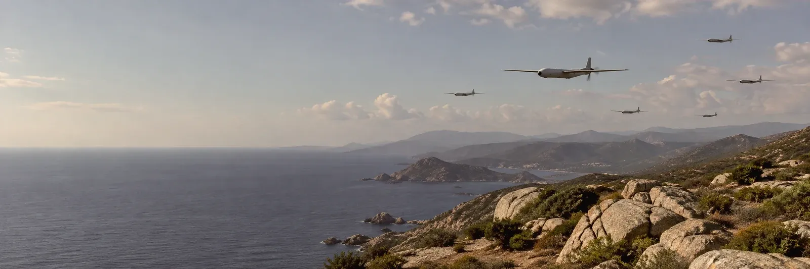 UAV formation above a rugged coastline